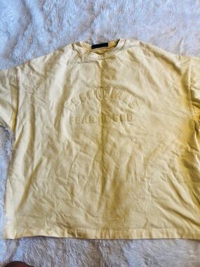 Fear of God ESSENTIALS Soft Yellow Embossed Logo Tee
